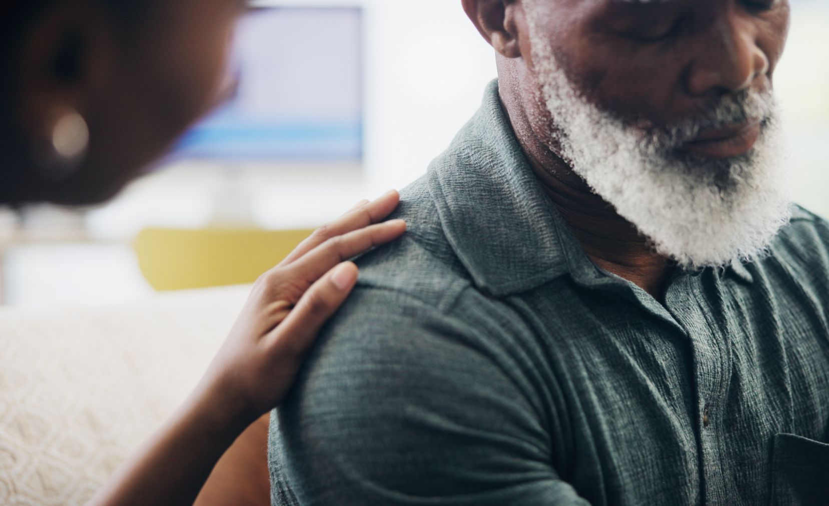 nurse comforting dying old man