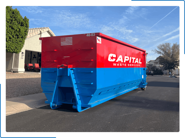A bright red and blue dumpster labeled