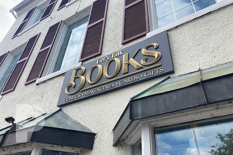 A building with a sign that says books on it