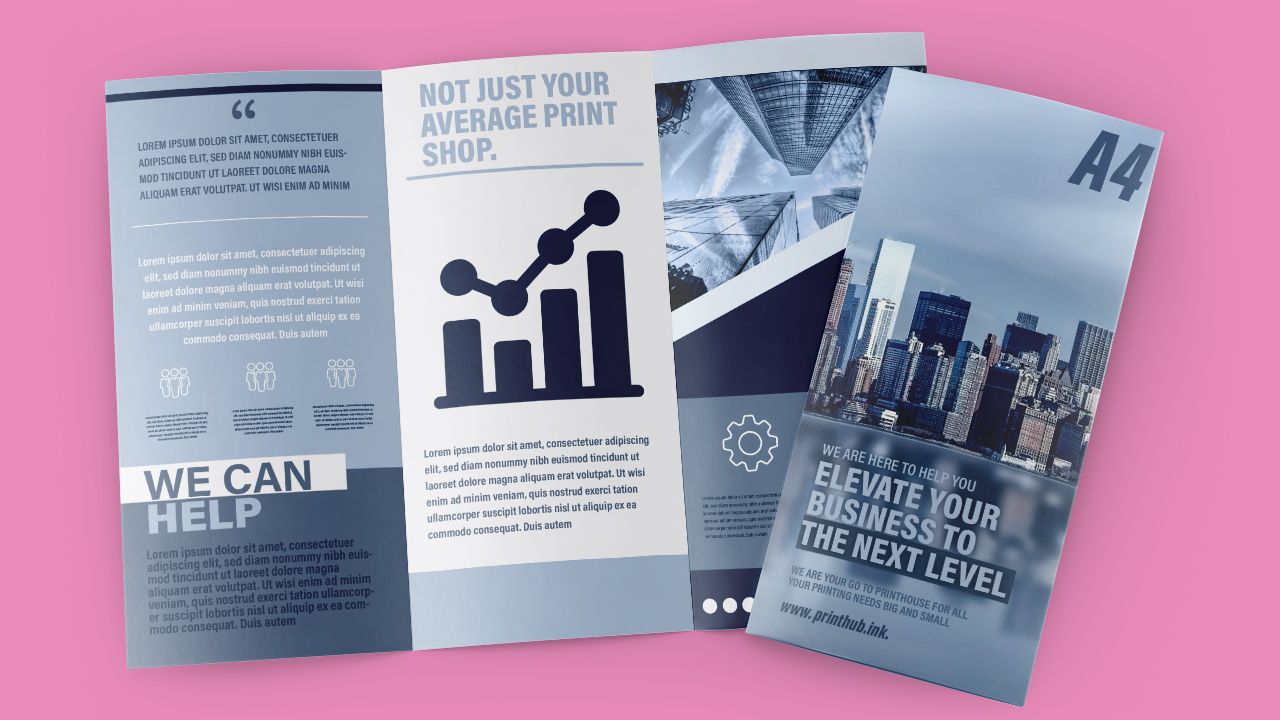 Three brochures are sitting on top of each other on a pink surface.