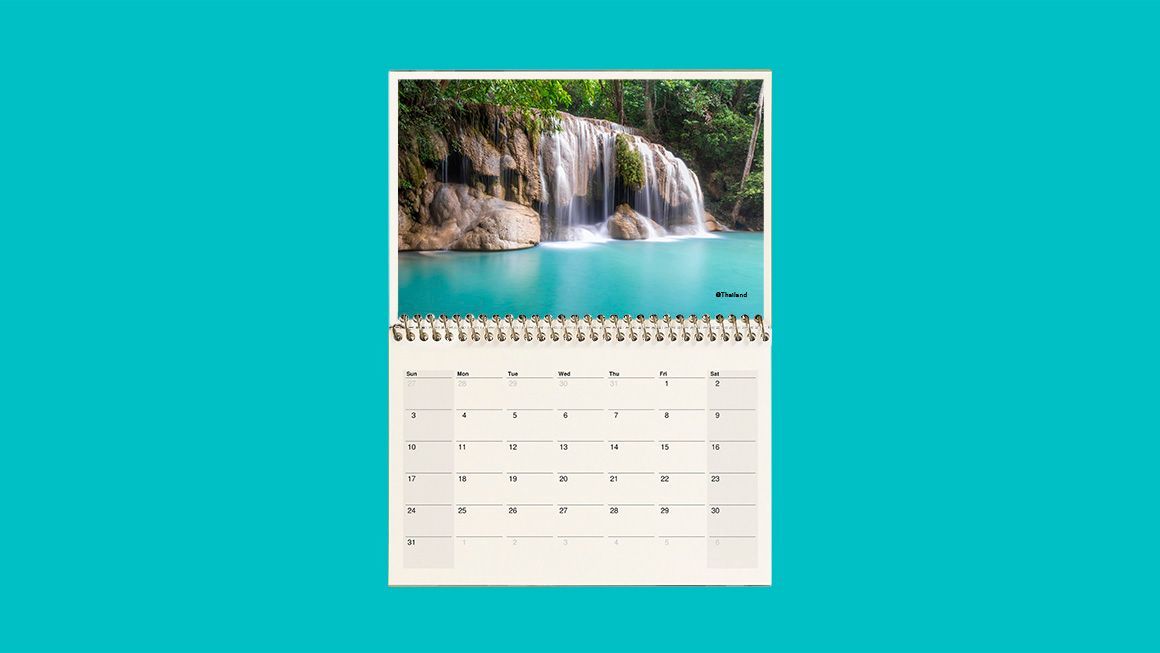 A calendar with a picture of a waterfall on it.