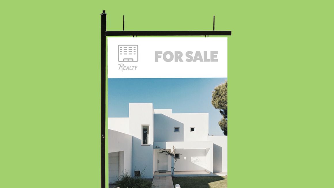 A for sale sign with a picture of a white house on it.