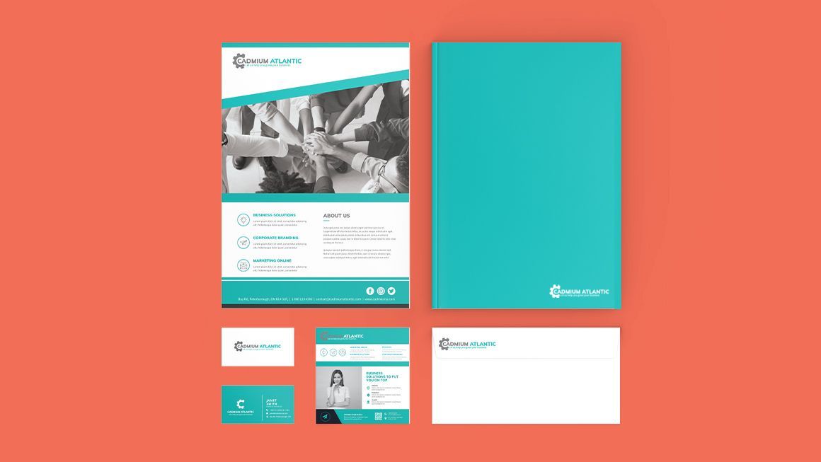 A set of business cards , envelopes , and a flyer on a red background.