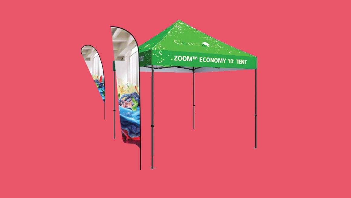 A green canopy tent with two flags attached to it on a red background.