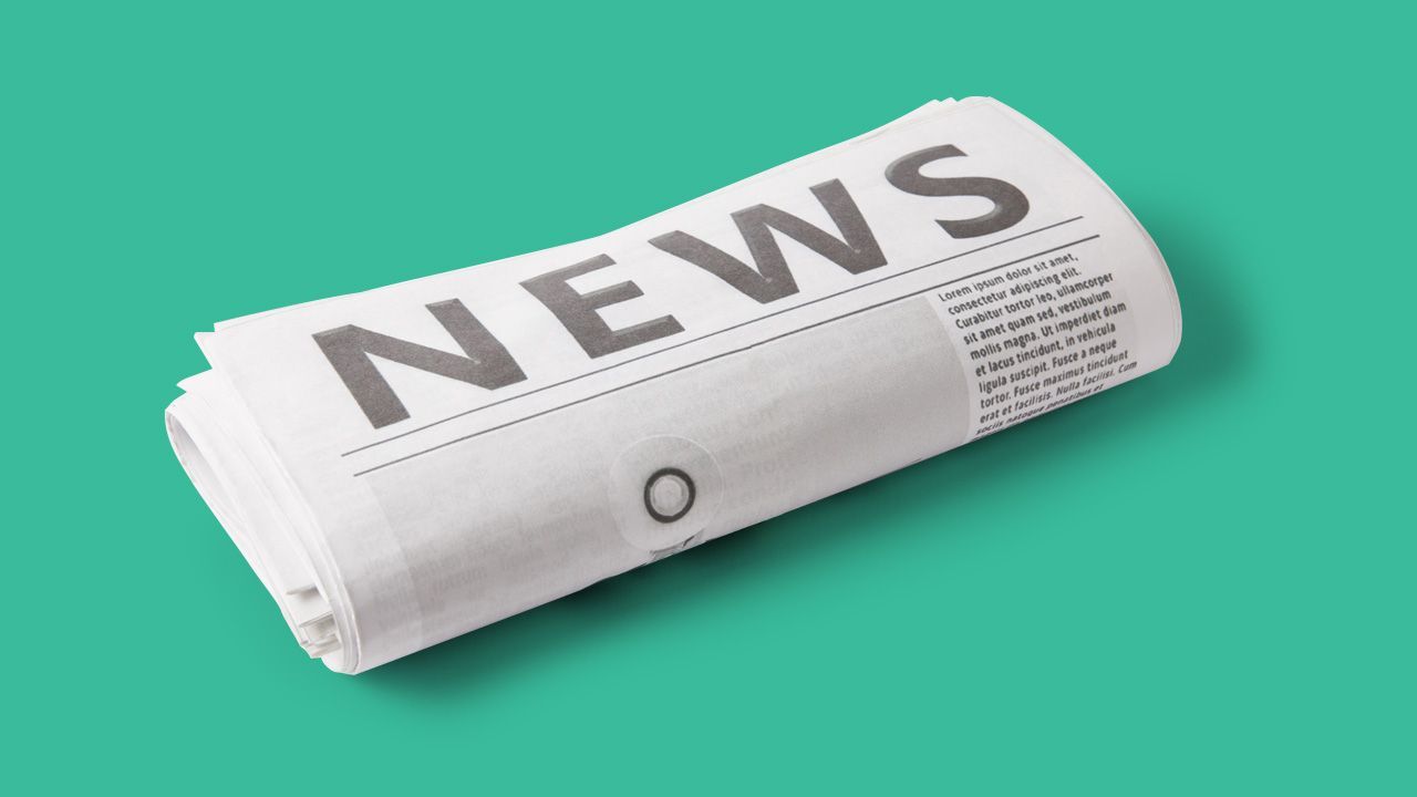 A newspaper with the word news written on it on a green background.