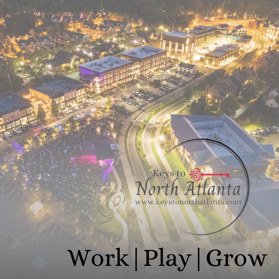Aerial night view of North Atlanta with lit buildings and 