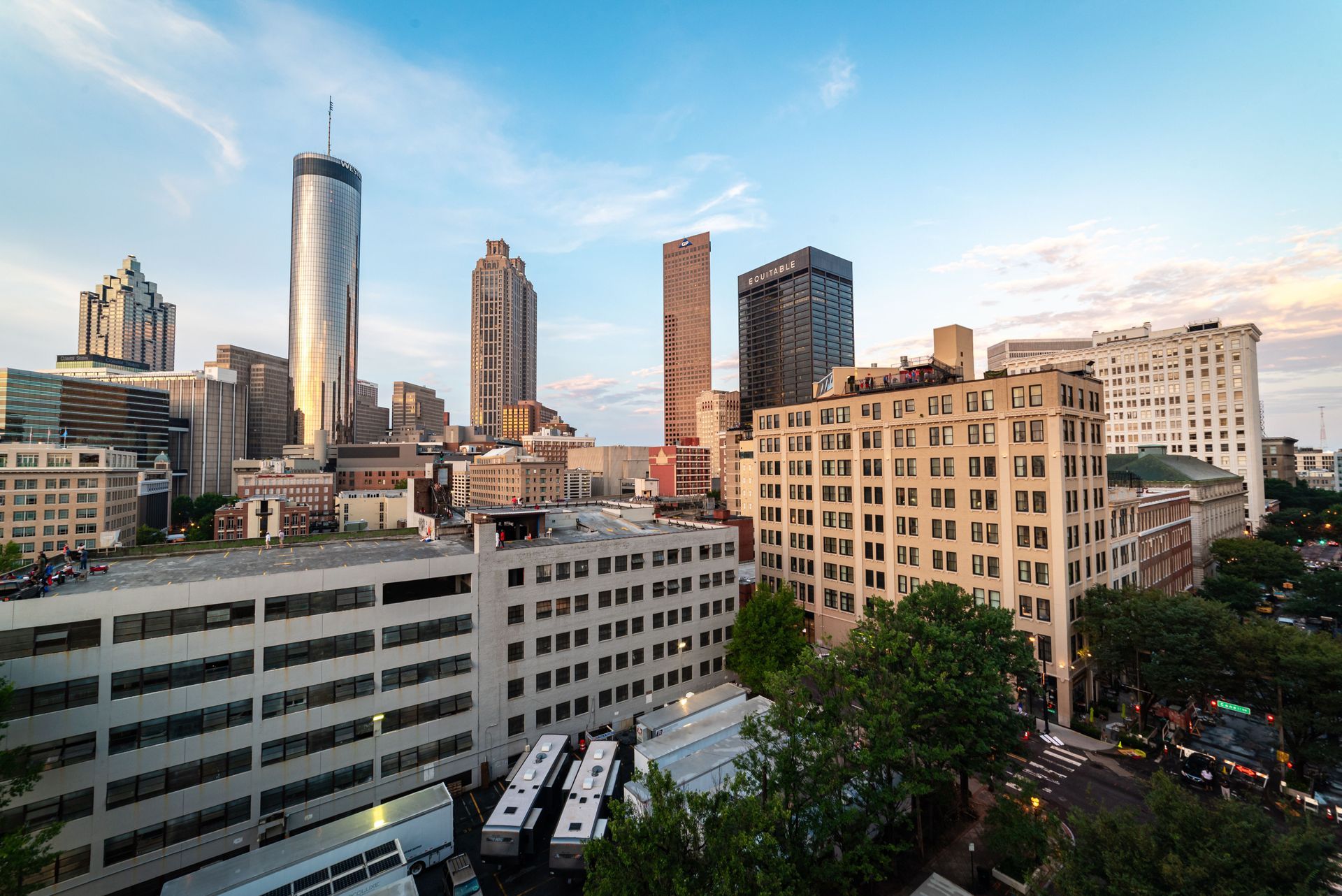 Downtown city skyline with tall modern buildings under a clear blue sky