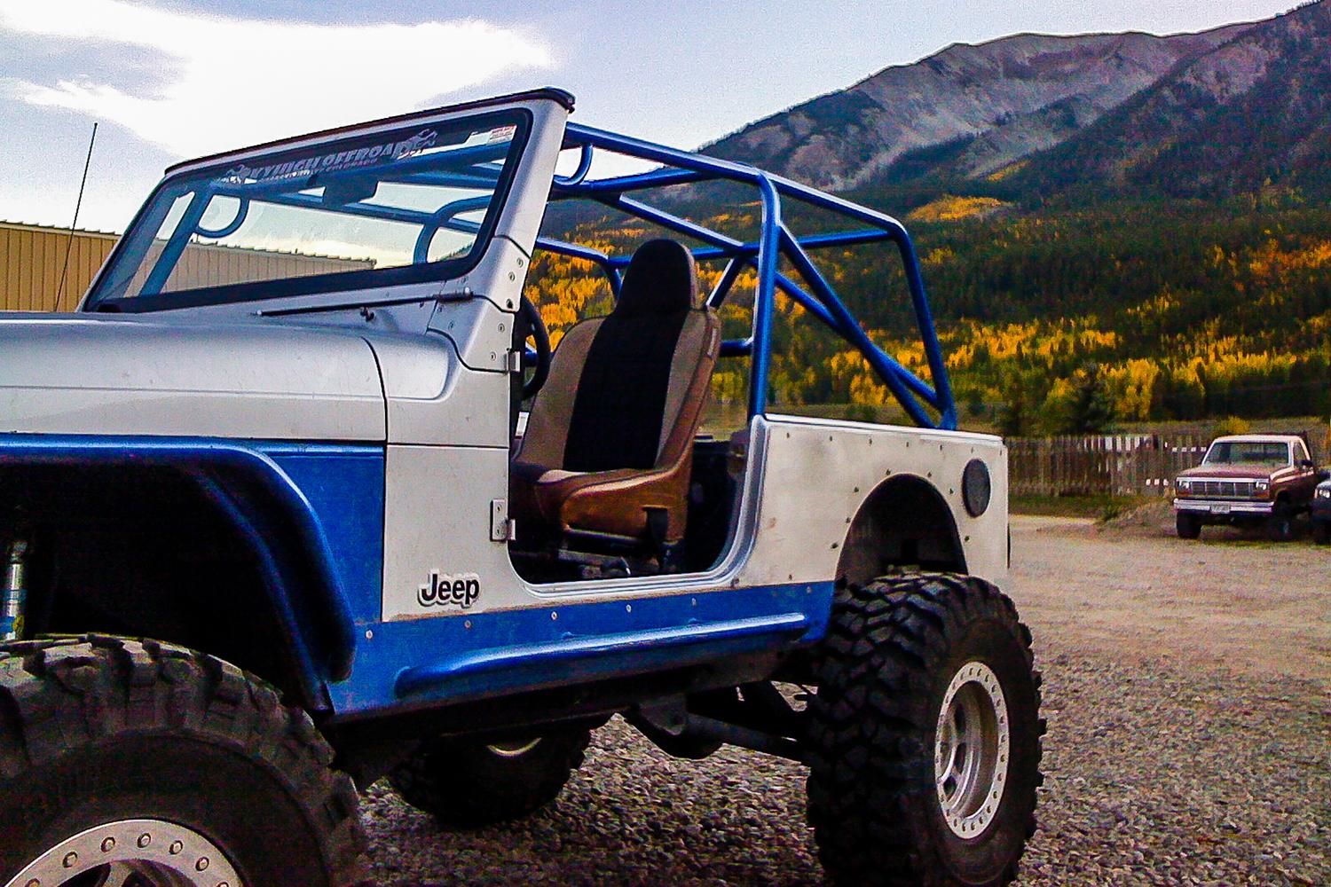 blue and silver lifted jeep