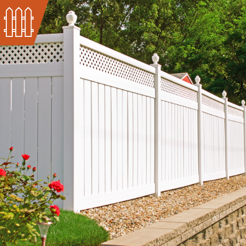 White vinyl fence in a garden setting with red roses.