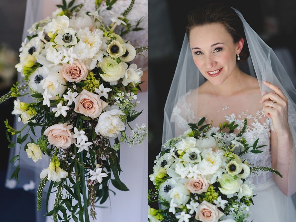 Bride with arms up, making a funny face, groom looking at his hand, cake cutting in background.