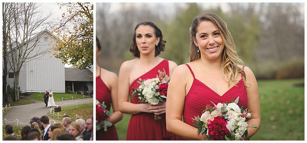 Wedding ceremony: Bride and groom walking toward barn, bridesmaids in red dresses holding bouquets.