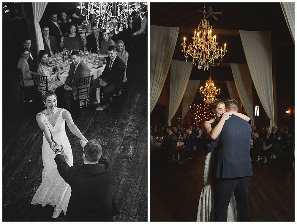 Wedding reception: couple dancing in a dark venue. Guests watch from tables.