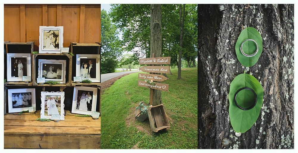 Wedding decorations: framed photos in crates, a directional sign, rings on leaves.