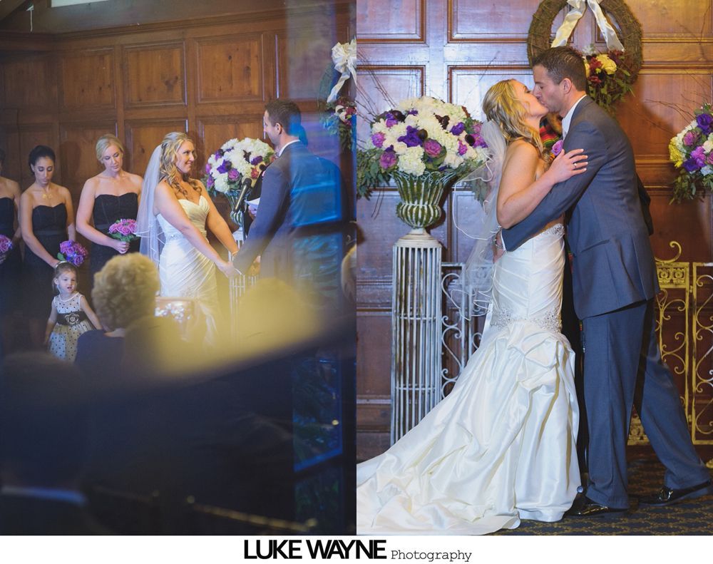Wedding ceremony and kiss: Bride and groom, ornate floral arrangements, and bridesmaids.