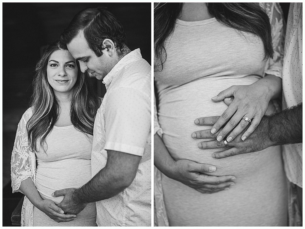 Pregnant couple in embrace, hands on belly; close-up of hands on belly. Black and white.