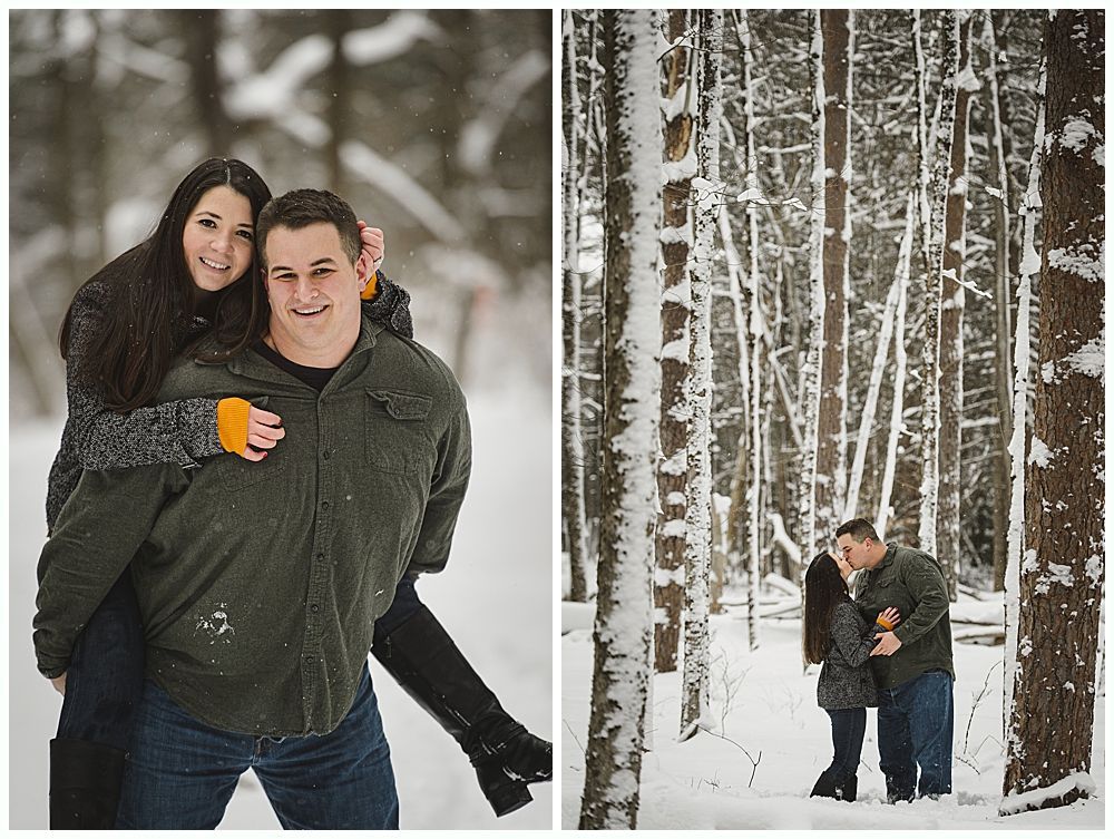 Couple in winter forest; man gives woman a piggyback ride, kissing in snow-covered woods.