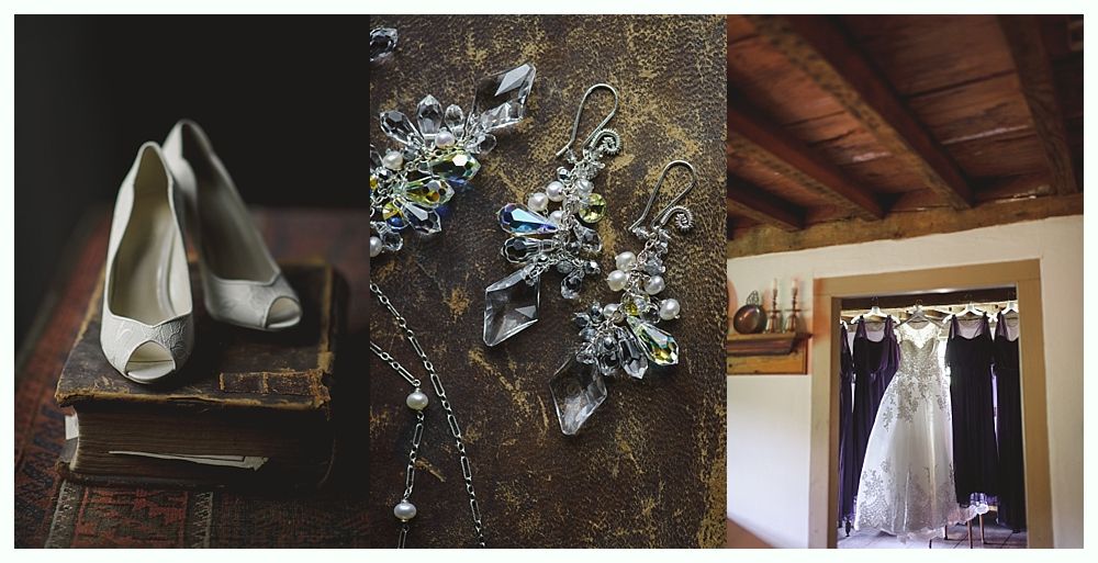 Wedding details: shoes on books, jewelry on textured surface, dress hanging in doorway.