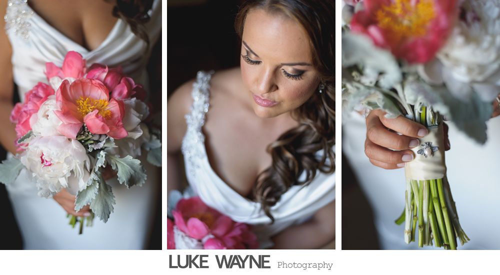 Bride in white dress holding pink peony bouquet; soft focus.