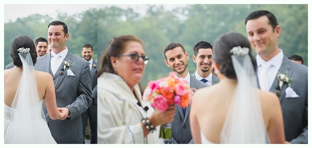 Bride and groom at wedding ceremony, surrounded by guests. The officiant holds flowers.