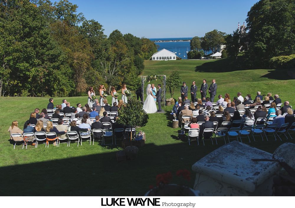 Triptych: stone statue, a sign with wedding details, and floral arrangement in a pumpkin.