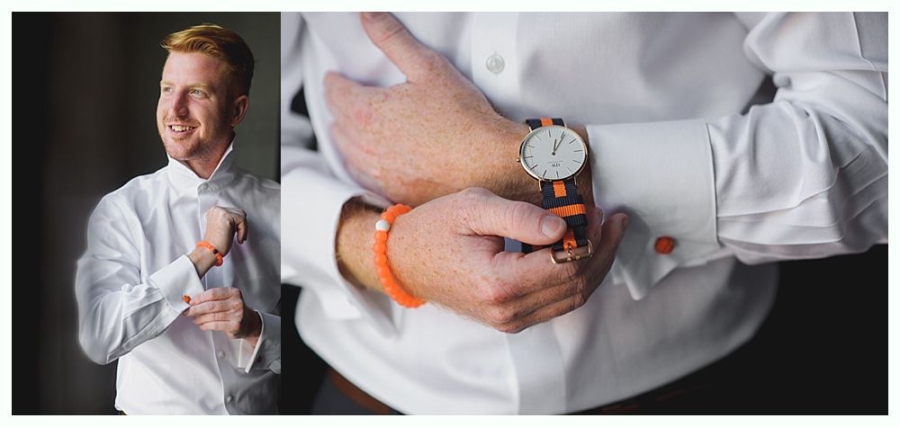 Man in white shirt adjusts cufflinks and looks away. Orange bracelet and wood watch.