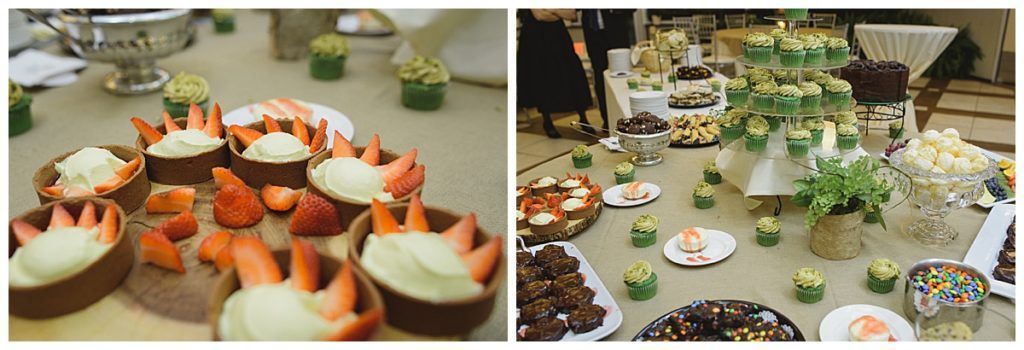 Dessert buffet with strawberry-filled cups, cupcakes, and other treats on a decorated table.
