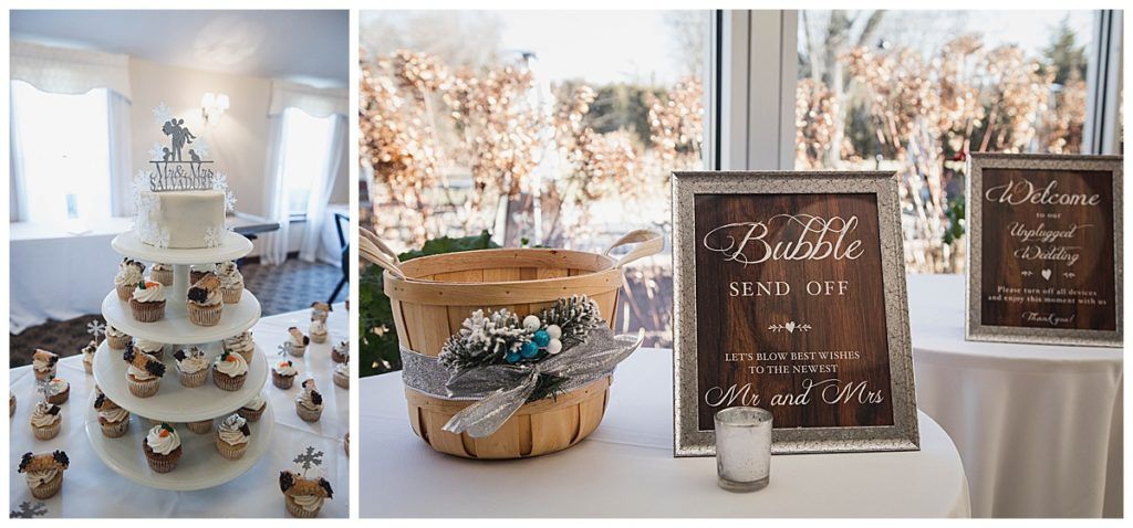 Wedding reception setup with cake, cupcakes, basket, and signs.