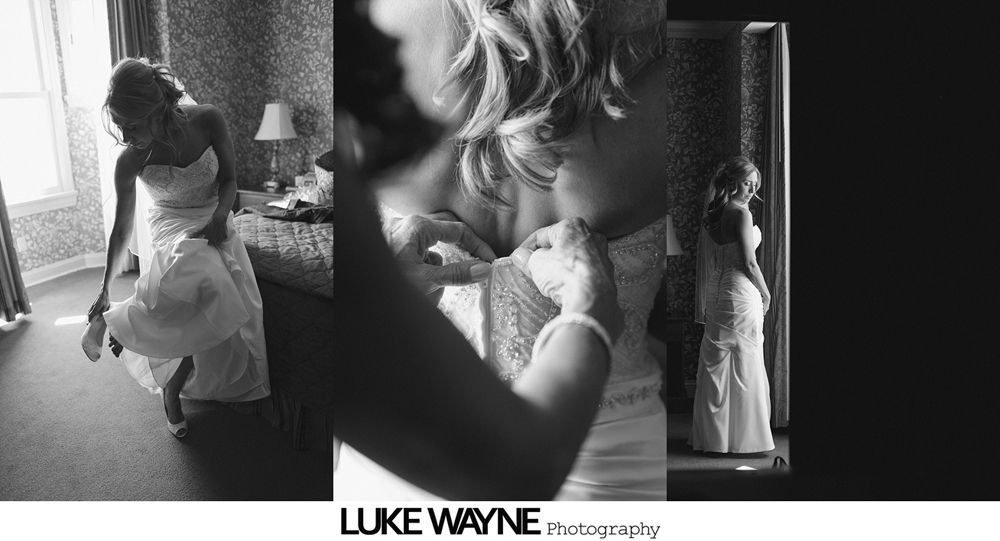 Bride getting ready for wedding, adjusting her dress in a room, black and white.