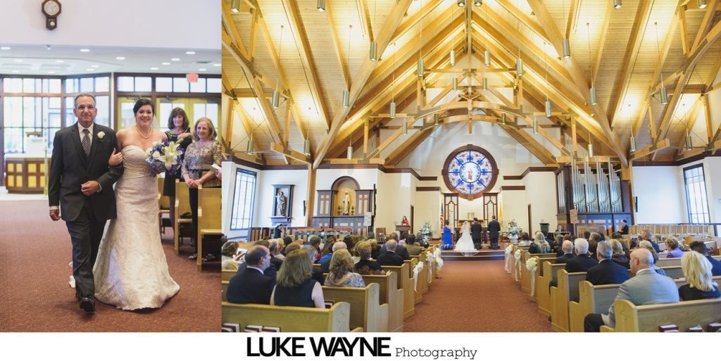 Bride walks down aisle with father, towards altar in church with guests.