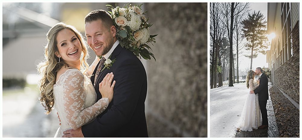 Wedding couple smiling, posing by a stone wall, and kissing in snowy woods with tall trees.