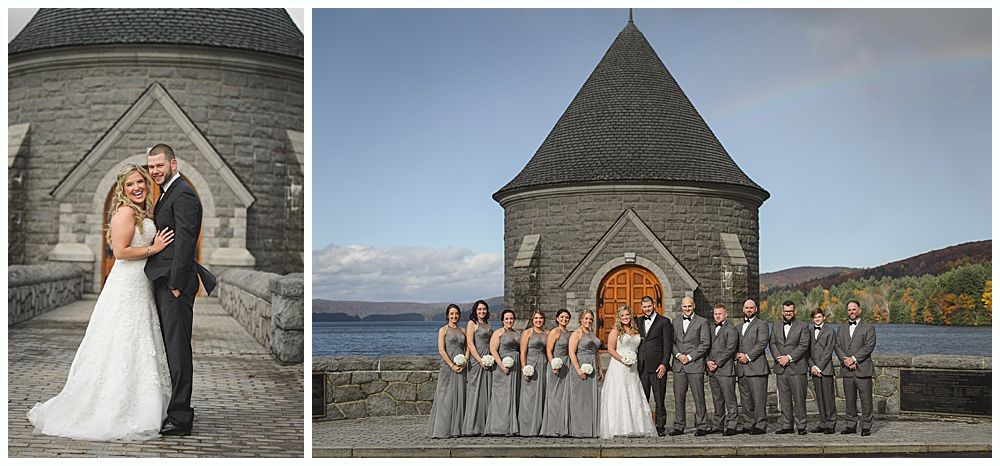 Wedding party in front of a stone building with a conical roof. Couple poses on the left, group photo on the right.