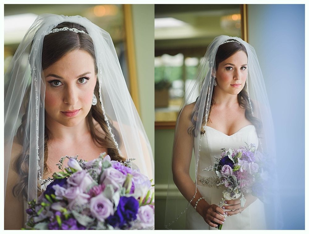 Bride with arms up, making a funny face, groom looking at his hand, cake cutting in background.