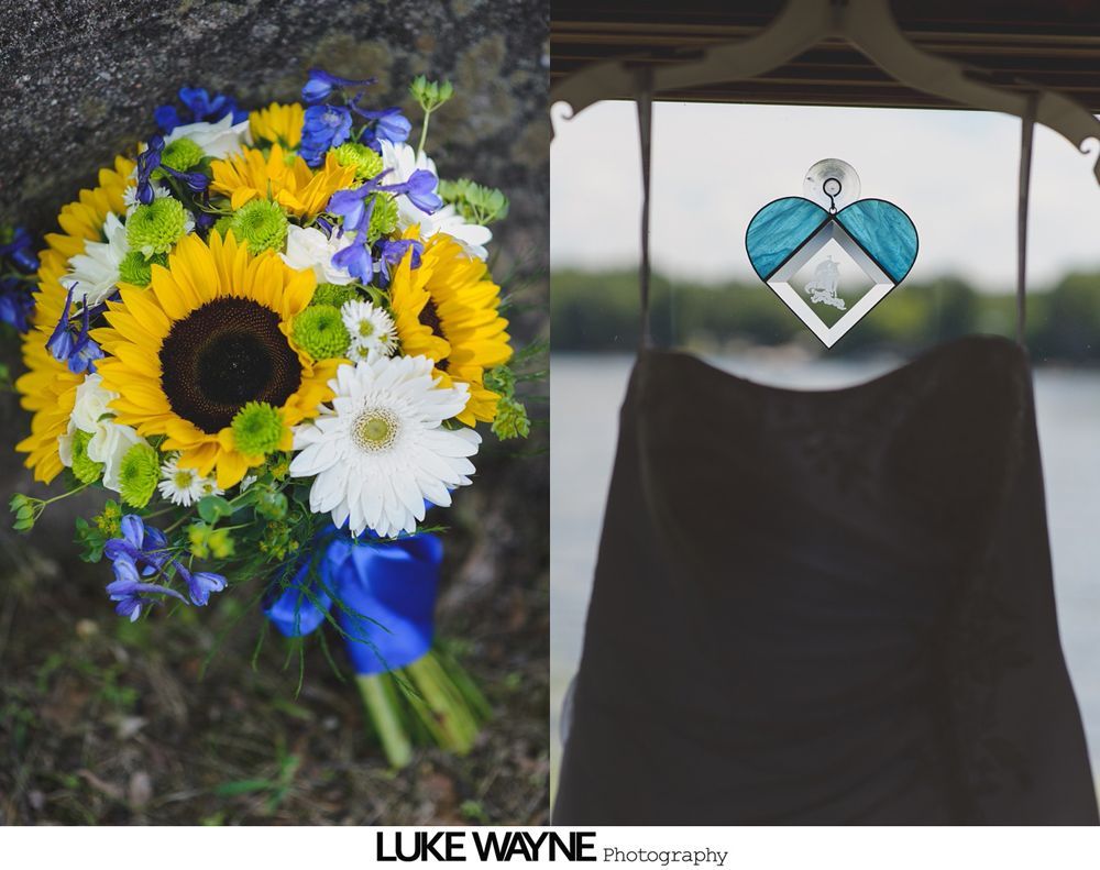 Wedding bouquet with sunflowers and blue ribbon; black dress with teal pendant.