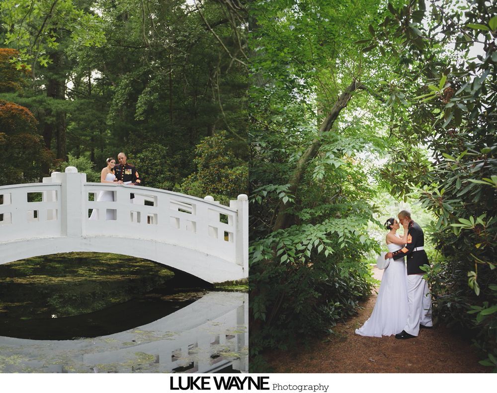 Bride and groom on a white bridge, and a path lined with greenery. Couple embrace; wedding day.