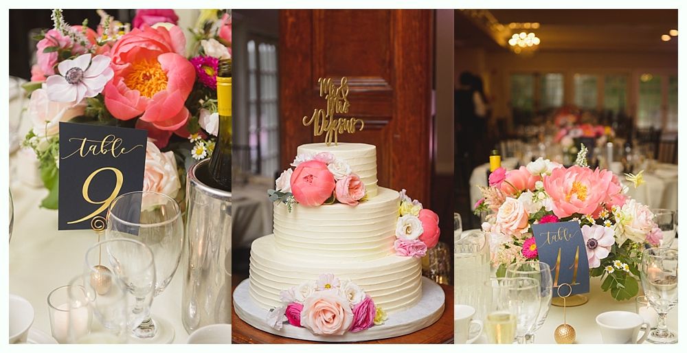 Cupcake display with wooden signs, crates, and tiered stands on a white table.