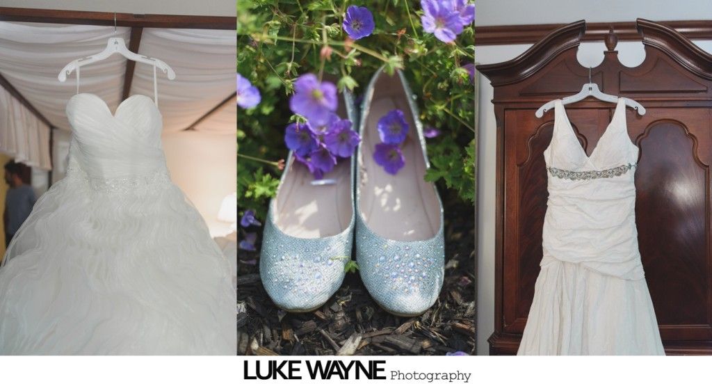 Wedding dresses and glittery shoes with flowers, hanging.
