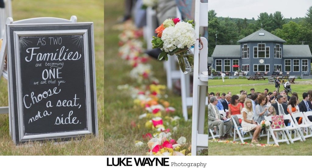 Wedding ceremony: chalkboard sign, floral aisle, guests seated before building.