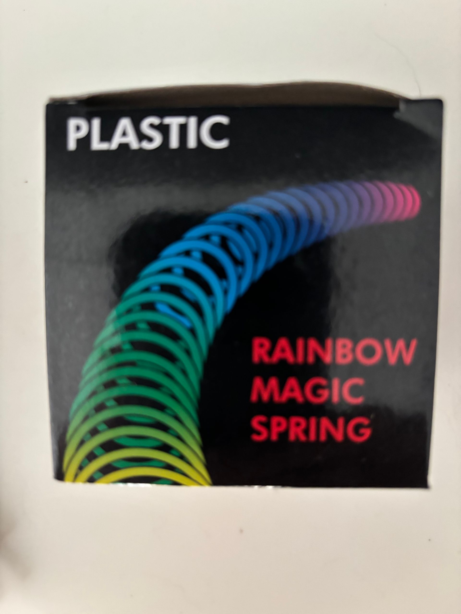 Rainbow Coil Spring Toy Plastic Toy Multi-color. A BOX of 60 pcs a special price