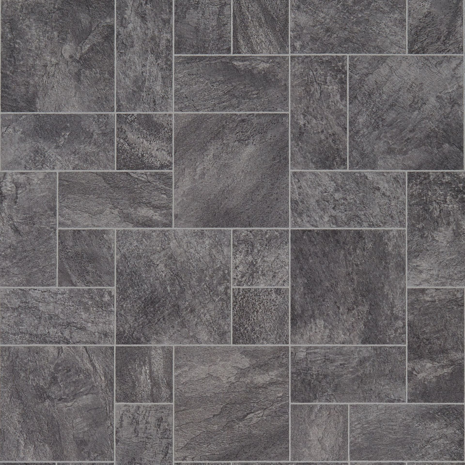 Dark gray stone tile flooring in a random pattern.