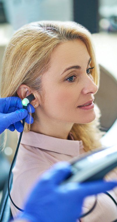 Woman Consulting Workers' Compensation Hearing Loss Injury Law Firm Ouimette, Goldstein, & Andrews, Servings Clients of the Hudson Valley for Over 45 Years