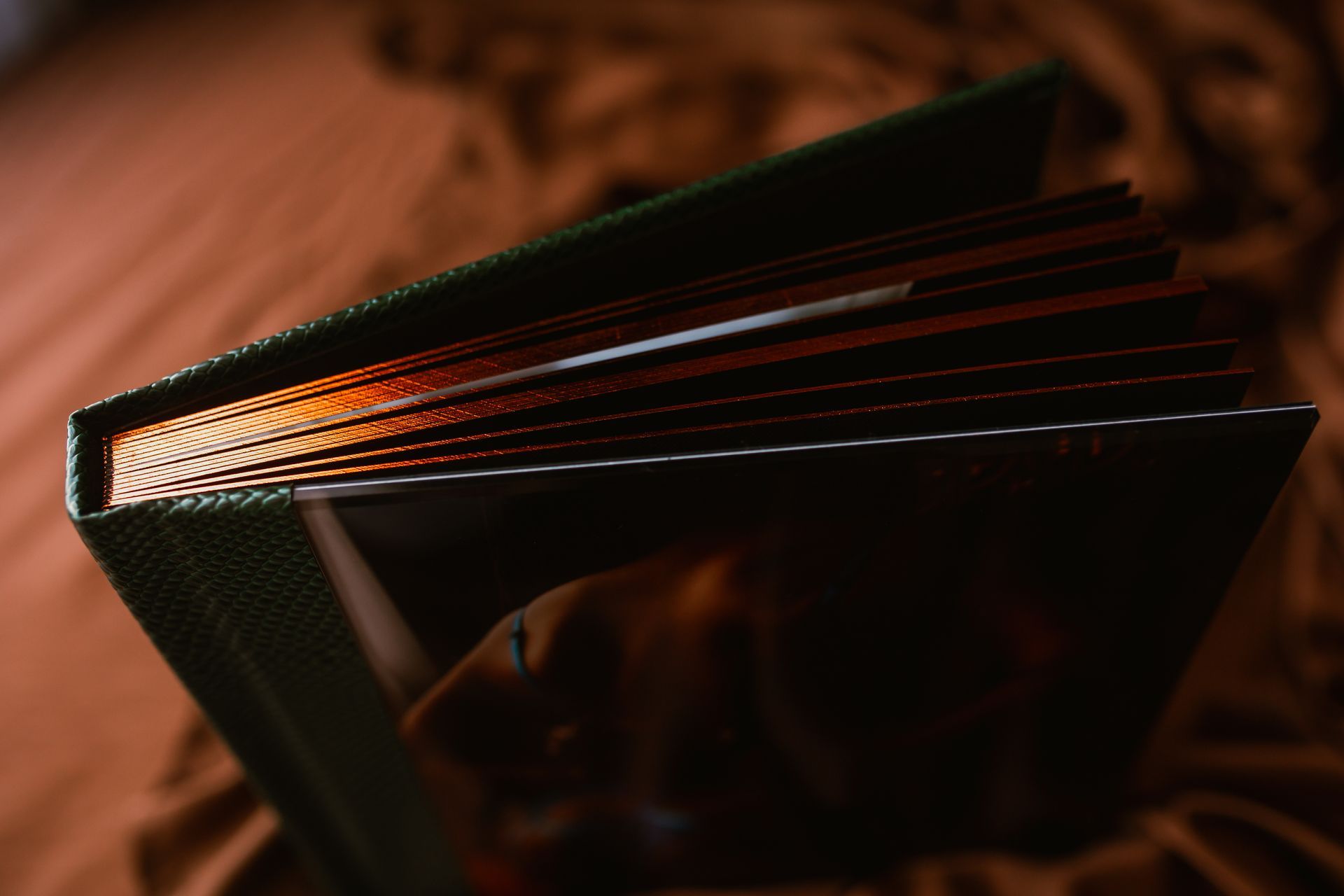 A close up of a book with a green cover