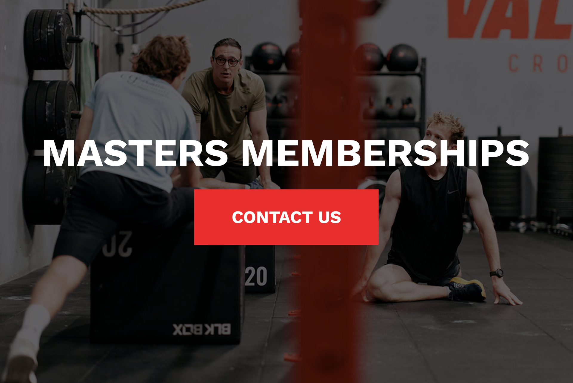 A group of men are doing exercises in a gym.