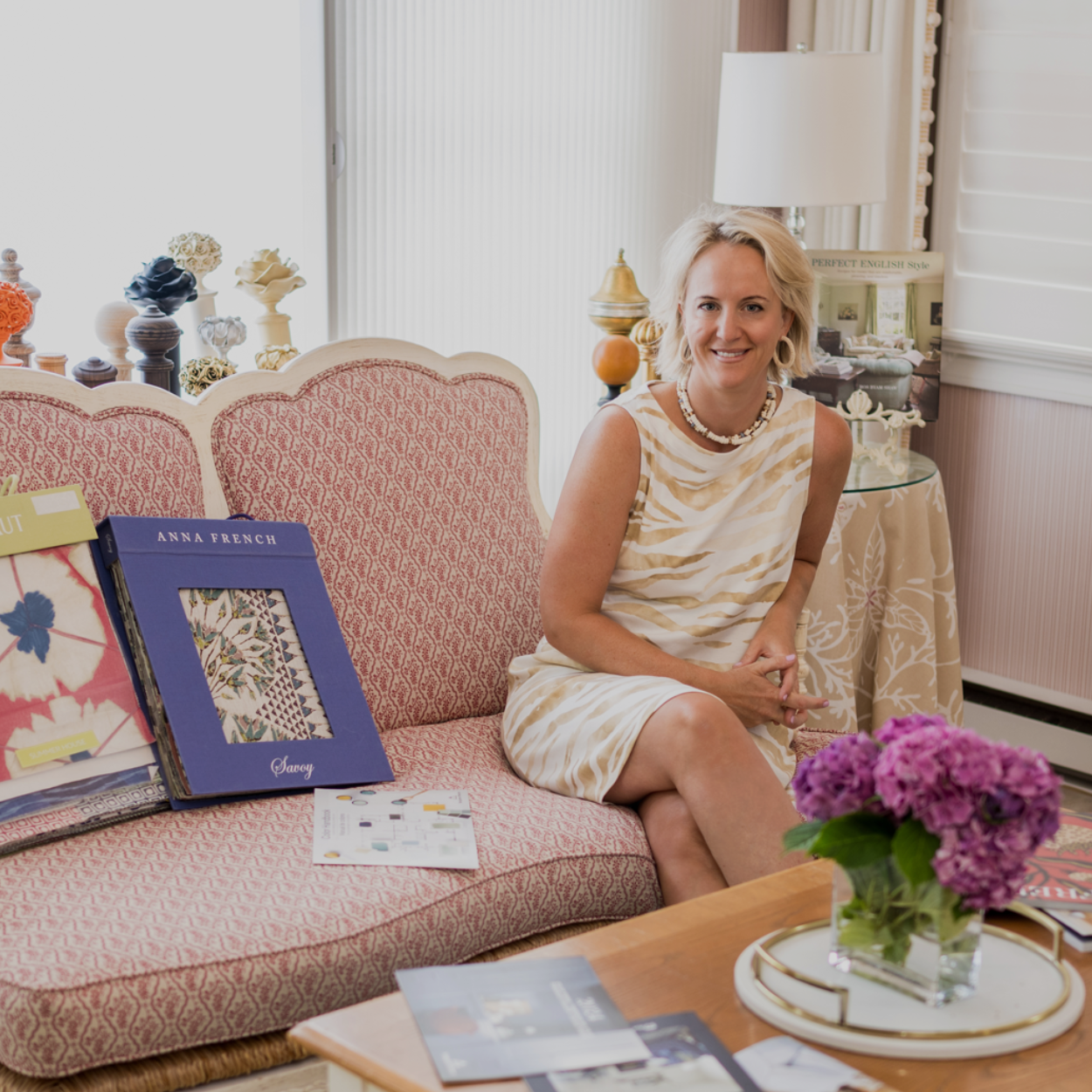 Client, Chelt Interiors -- Owner Isy Jackson of Chelt Interiors sitting on a couch