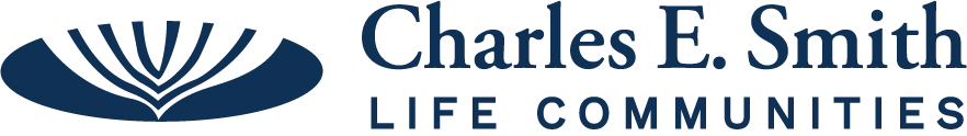 Logo for Charles E. Smith Life Communities: a blue abstract leaf icon next to the organization's name in blue text.