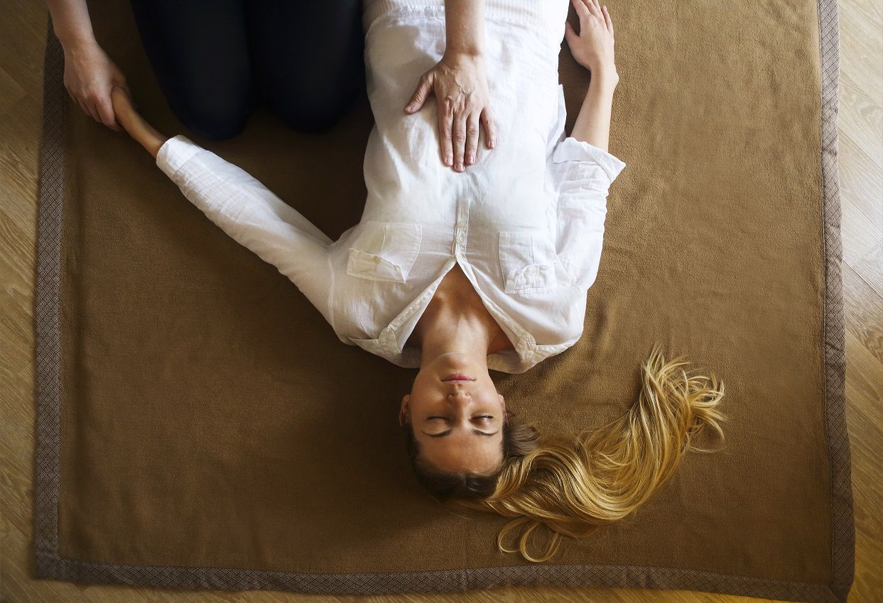 Hand being pressed on a woman's chest