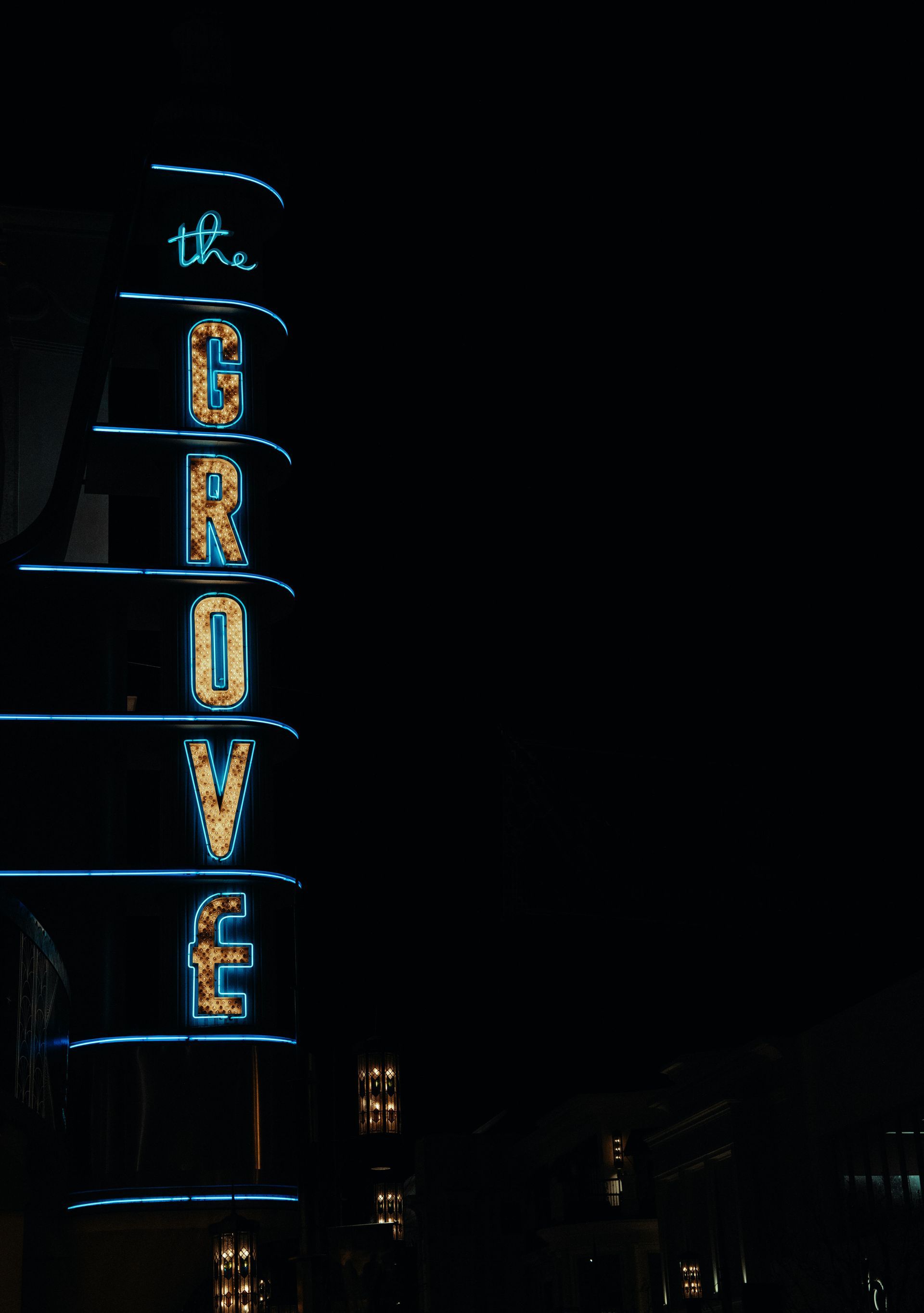 Vertical, neon-lit sign for 