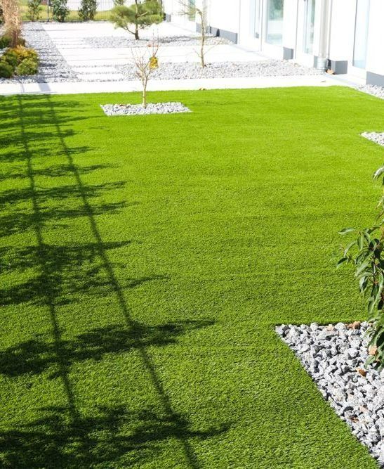 A Vibrant Green Artificial Lawn Framed by Grey Gravel Pathways — Ballina Turf Farm in Tweed Heads, NSW