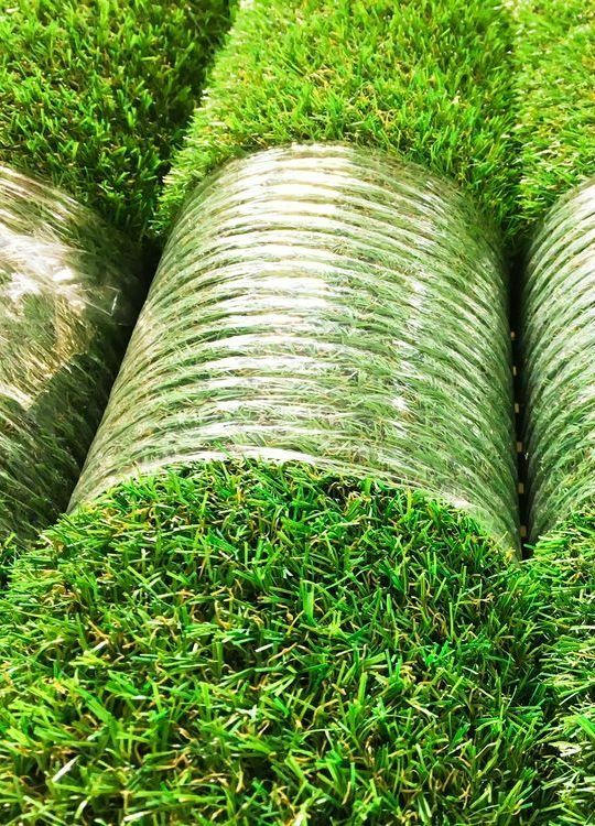 Rolls of Fresh Green Sod, Some Wrapped in Clear Plastic, Arranged in Rows — Ballina Turf Farm in Kingscliff, NSW