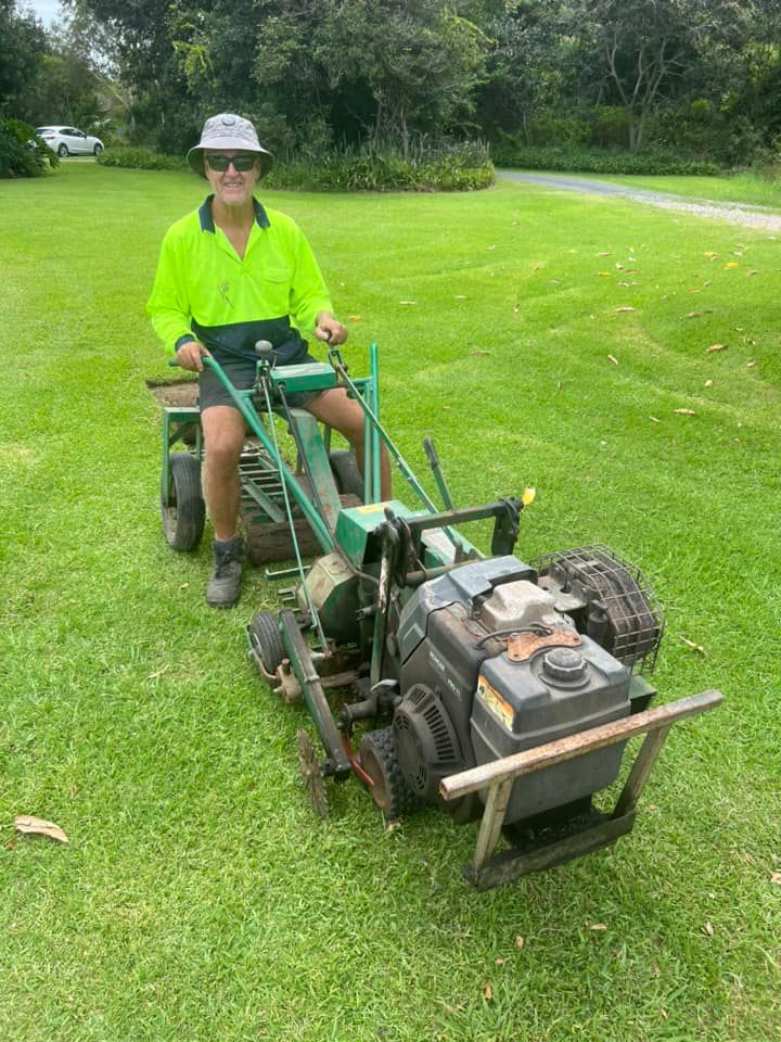 A Man is Riding a Lawn Mower on a Lush Green Field — Ballina Turf Farm in Wardell, NSW
