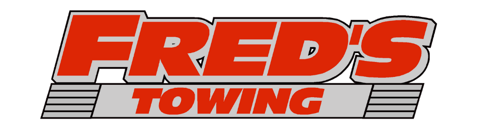 Fred's Towing logo in red and gray text.